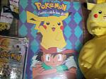 A Large, hard poster board of Ash and Pikachu. I got it from a friend.