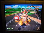 WOWZA, IT'S A BOWSER!

I was messing around with my GameCube Action Replay and Mario Kart Double Dash!! This is the code that makes your kart and players huge. That being the case if you select something already large, it will take up a good chunk of the screen as demonstrated here by Bowser and Donkey Kong. Really fun for Mushroom Bridge/City where you can't see the traffic.