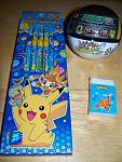 More Korean goods. Pencils on the left, Buizel eraser on the bottom right, and an Ultra Ball on the top right. The Ultra Ball contains a figure and a sticker.