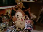 A view of my Pikachu plushie, and my Charizard plushie.(also the elusive, buy it only directly from Nintendo a few years ago, Pokemon Box!)