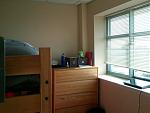 A view of my dorm room from the door. You can see the laptop and part of my bedframe from here!