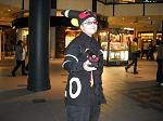 An awesome guy dressing like Umbreon and has a plushie of it.