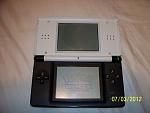 Custom DS Lite with white top half and black bottom half. Many thanks to Yoshi648 for assembly.